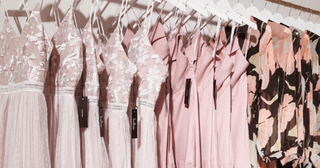 Pink dresses hung up with Lulu's tags