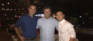 Three men standing together