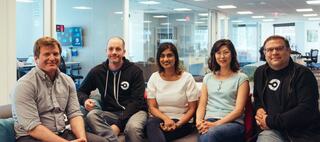 Group of people sitting on an office couch